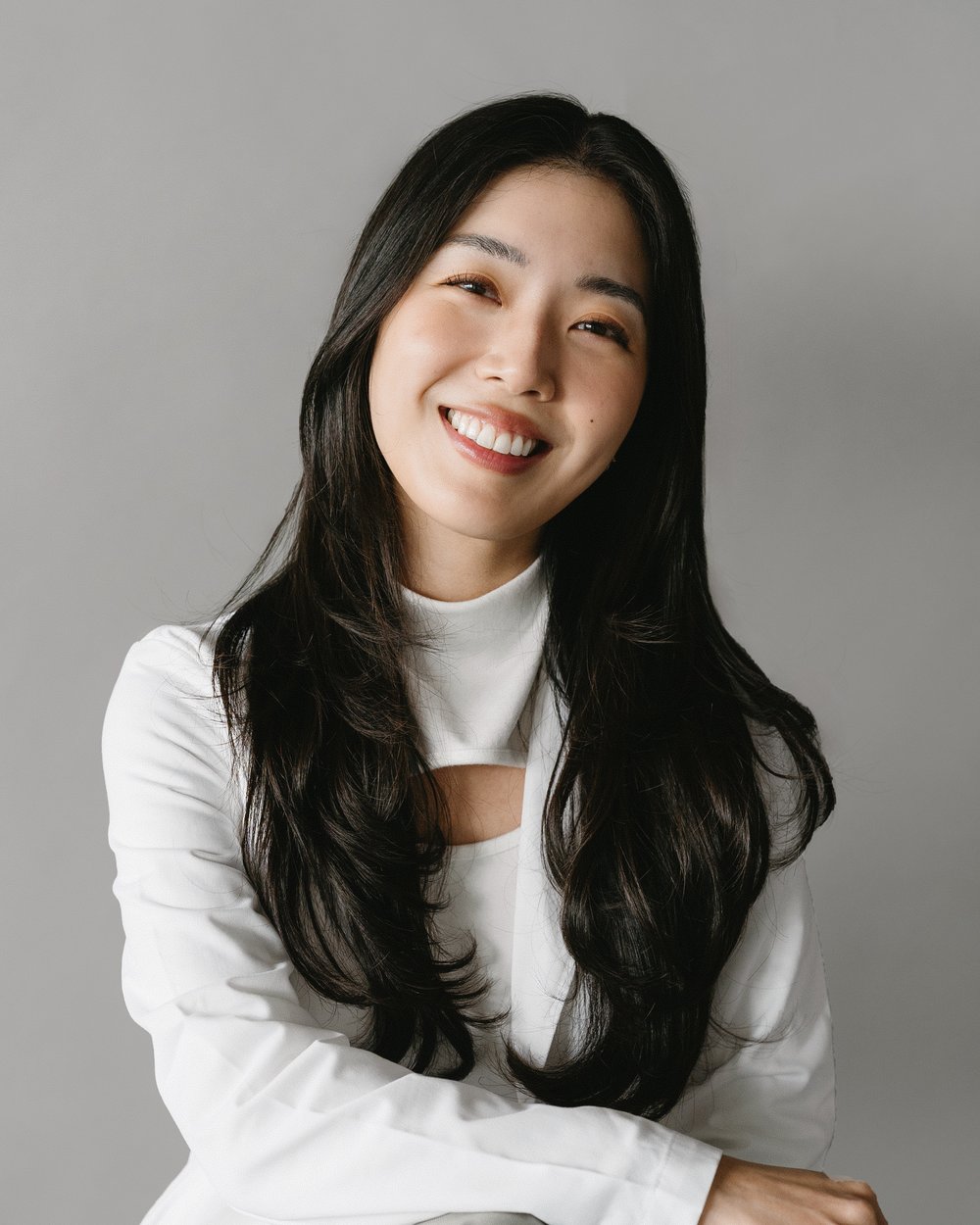 Dr. Rachel Kim in her white coat